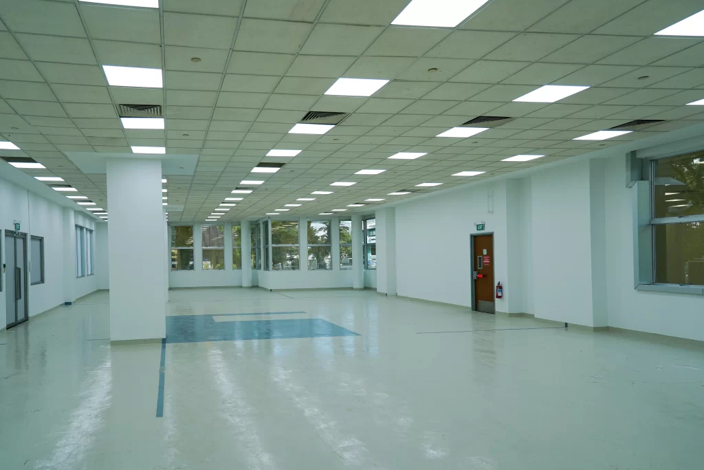 Large, empty office space with windows for lease on Level 1 of the Singapore G building